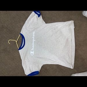 Grey Champion tee with blue lining.